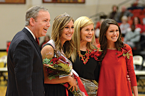 Abbey Orr is crowned Homecoming Queen by Dub Oliver, Susie, and Mel Arias.