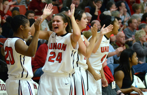 Keren Boyce and Natalie Smith celebrate a point in a tournament game March 13, 2015.